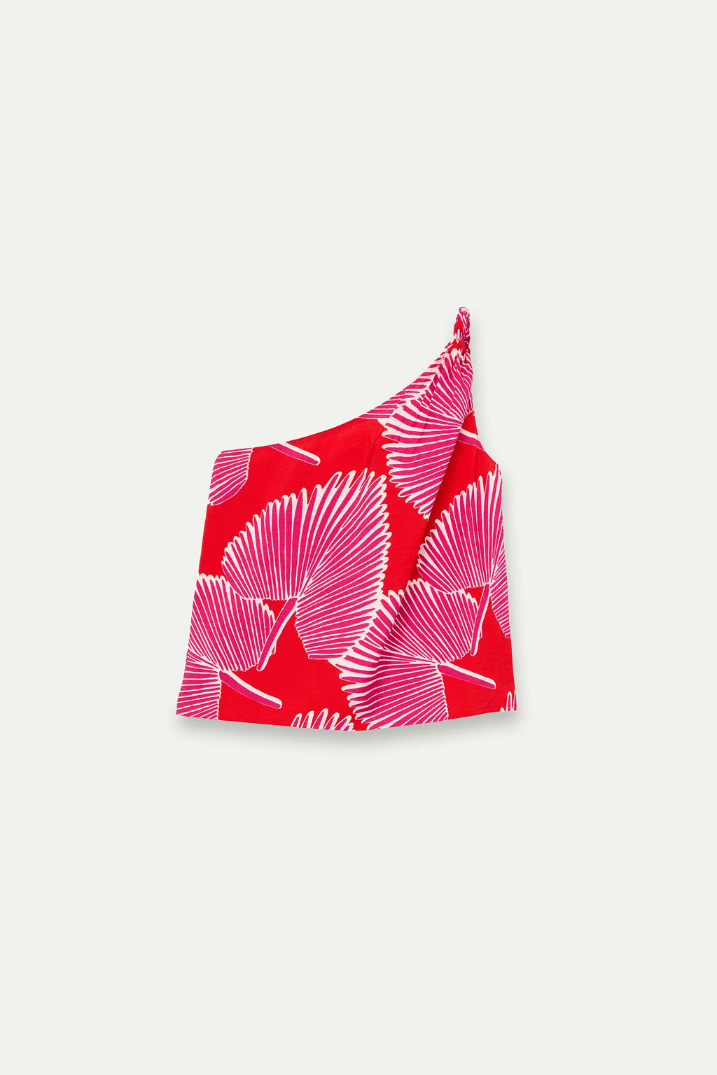 Top monospalla con stampa di palme rosa e panna su fondo rosso, fotografato disteso senza modella